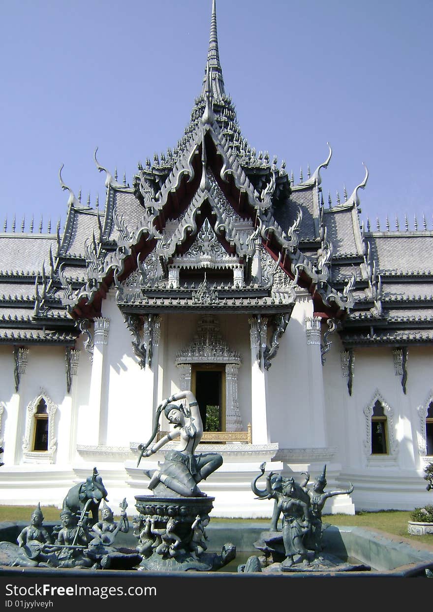 Fountain with central Mother Earth sculpture in front of Thai temple. Fountain with central Mother Earth sculpture in front of Thai temple