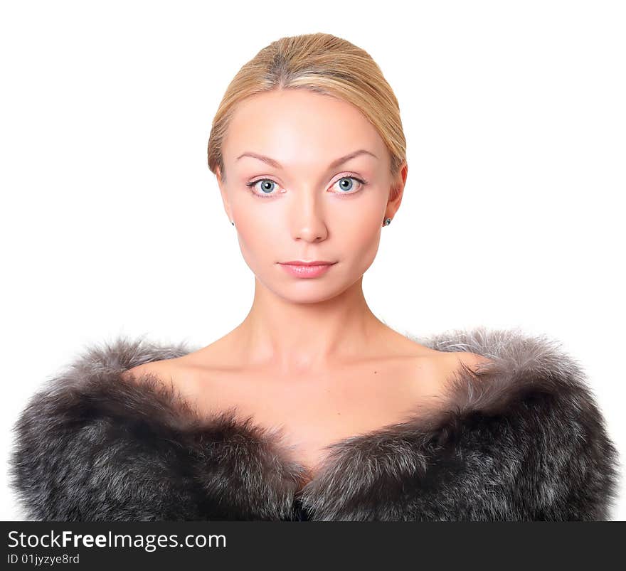 Portrait of the beautiful blonde with fur on shoulders, isolated on a white background, please see other photos of this series. Portrait of the beautiful blonde with fur on shoulders, isolated on a white background, please see other photos of this series