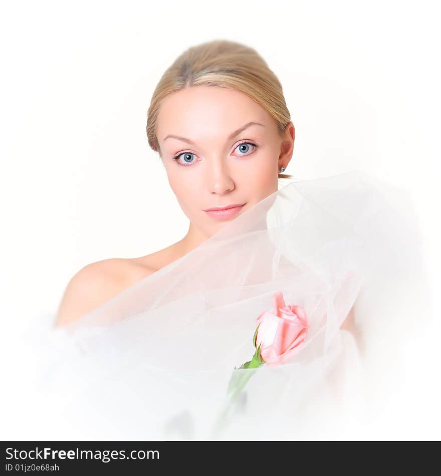 Gentle portrait of the charming girl with a pink rose. Gentle portrait of the charming girl with a pink rose