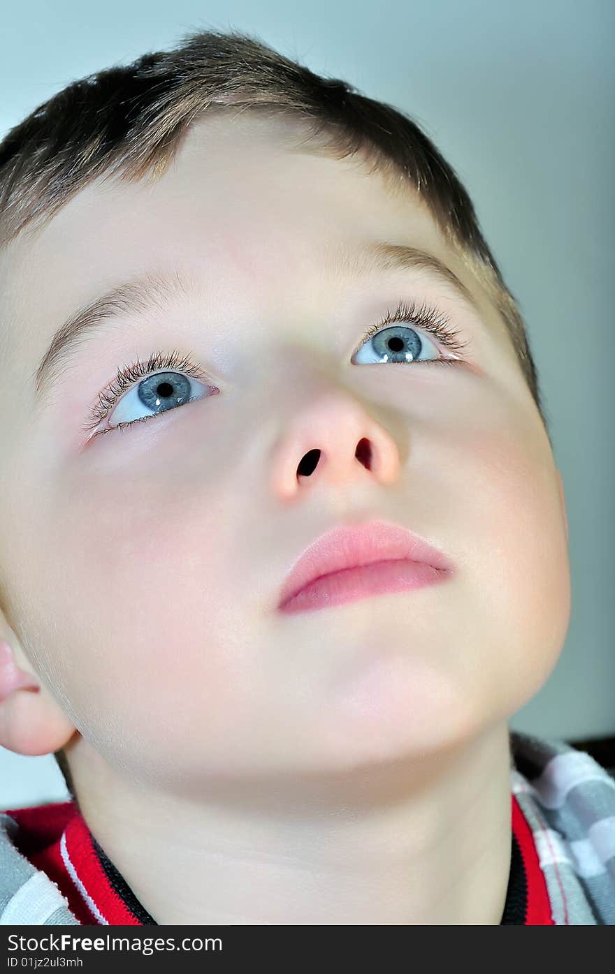 Portrait of a boy who looks to the top