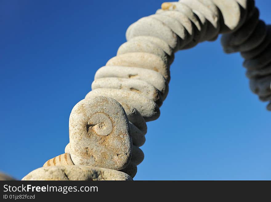 Air arc of pebbles in the blue sky. Air arc of pebbles in the blue sky