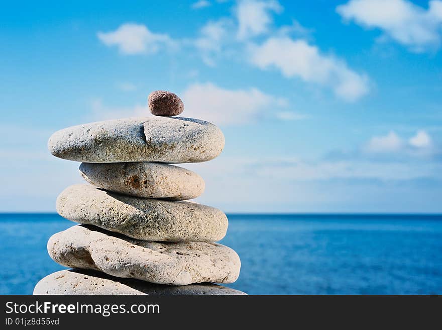 Small red stone completes the pyramid of cobblestones. Small red stone completes the pyramid of cobblestones