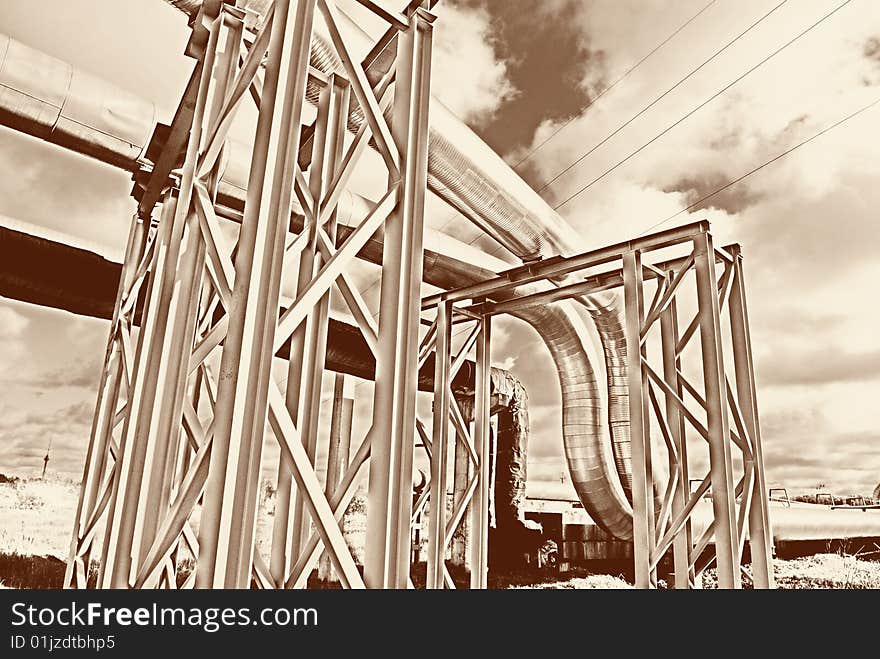 Steel pipe-line is photographed on sky background