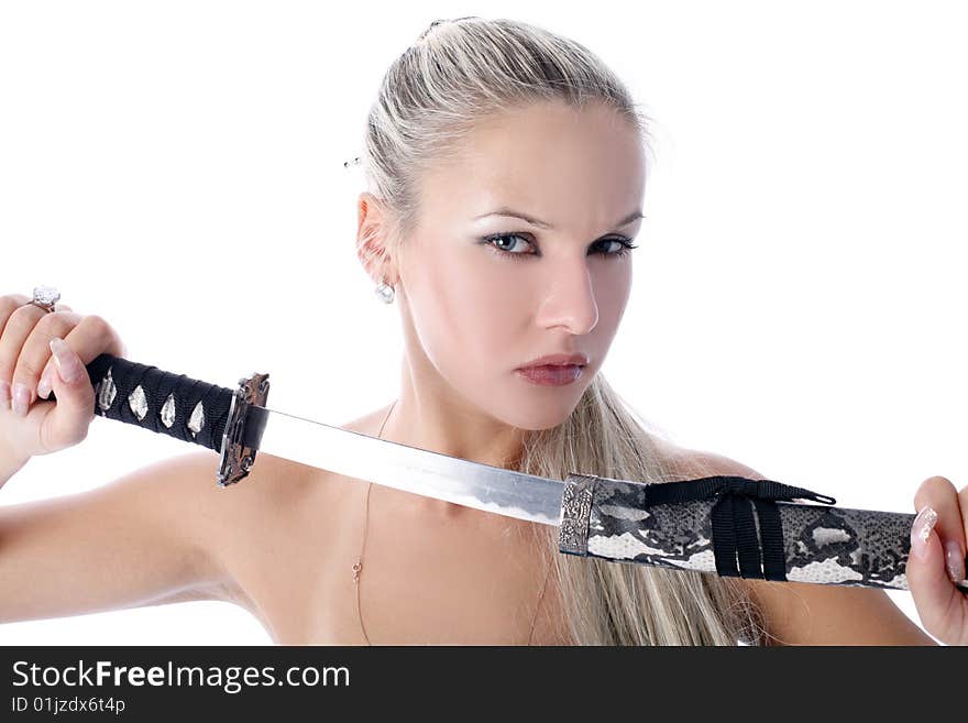 Lovely woman holding in her hands a katana isolated on white. Lovely woman holding in her hands a katana isolated on white