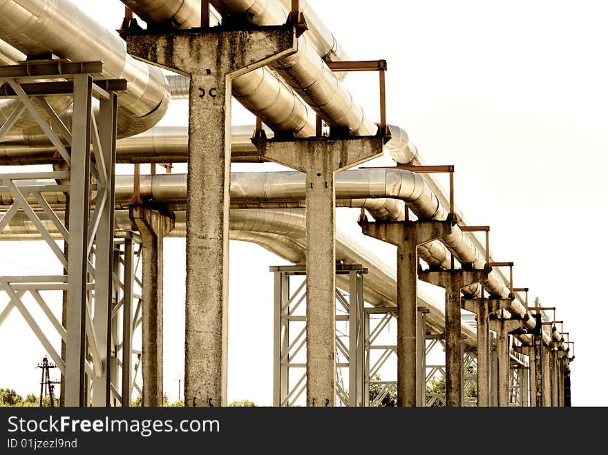 Steel pipe-line is photographed on sky background