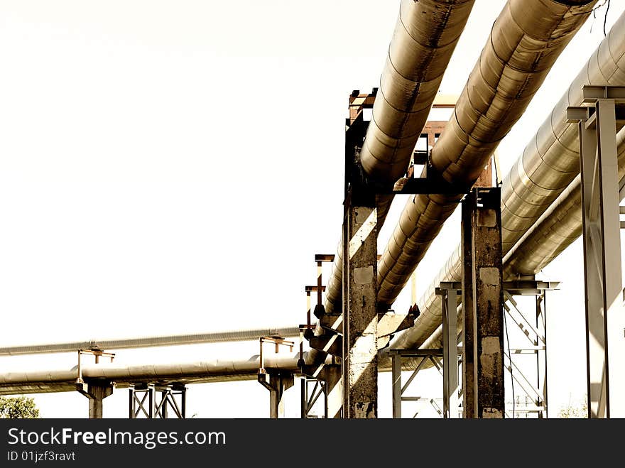 Metallic pipeline over blue sky. Metallic pipeline over blue sky