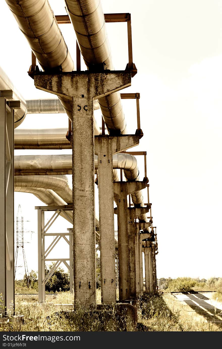 Metallic pipeline over blue sky. Metallic pipeline over blue sky