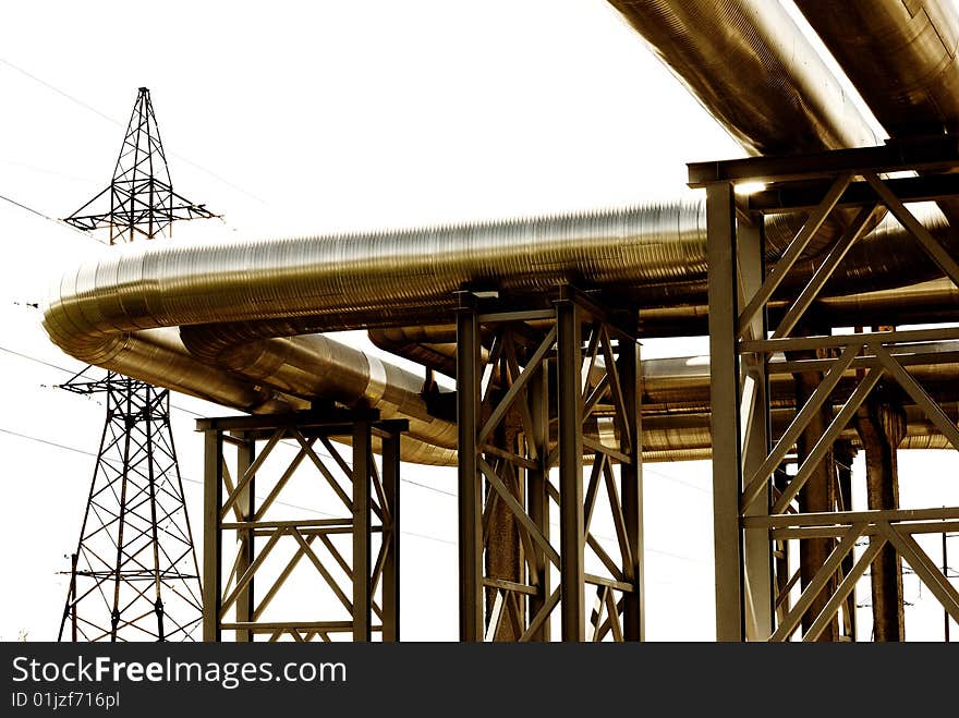 Metallic pipeline over blue sky. Metallic pipeline over blue sky