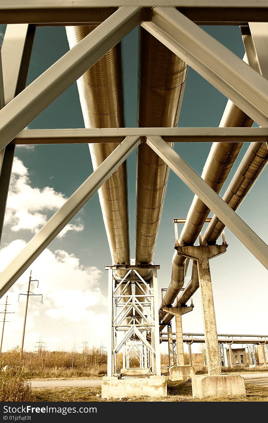 Steel pipe-line is photographed on sky background