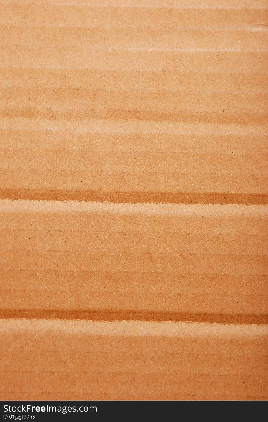 Brown corrugate cardboard close-up background