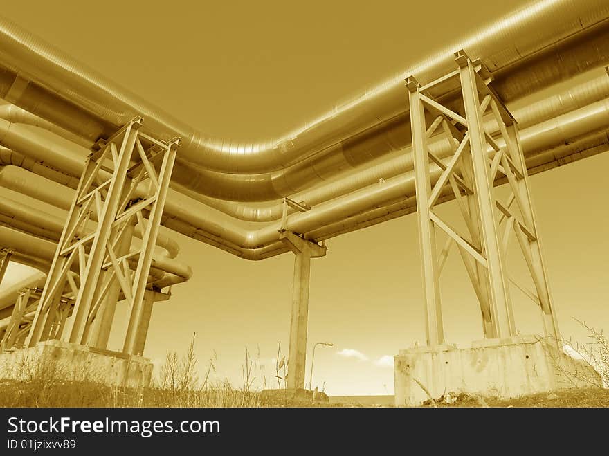 Metallic pipeline over blue sky. Metallic pipeline over blue sky