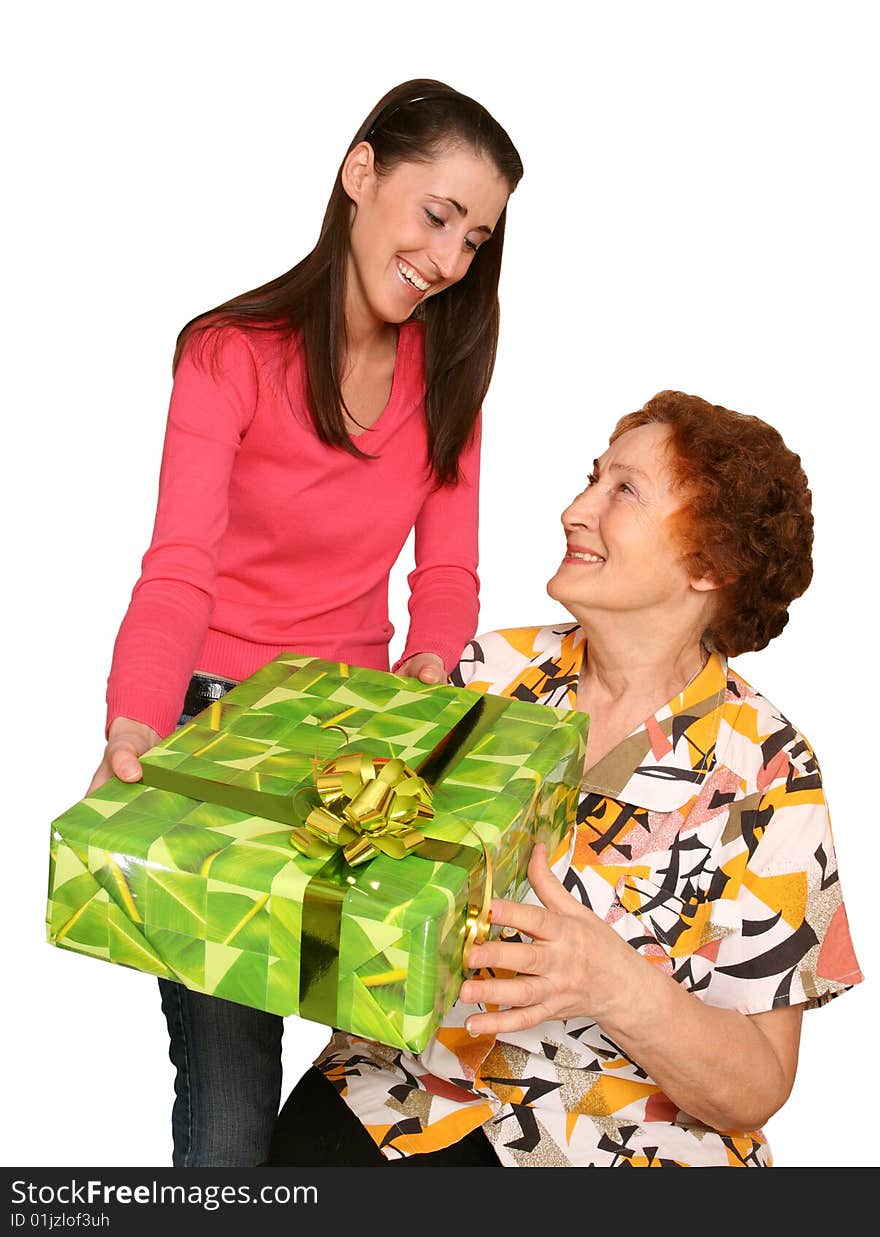 The young girl gives a greater holiday box with a bow elderly the signor. The young girl gives a greater holiday box with a bow elderly the signor