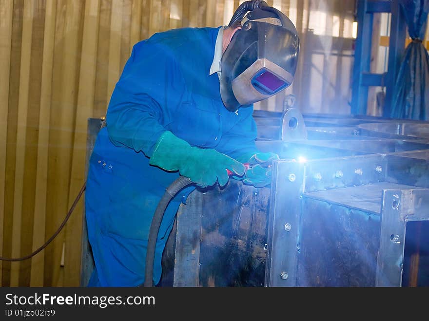 Welder at work. Industrial photo.