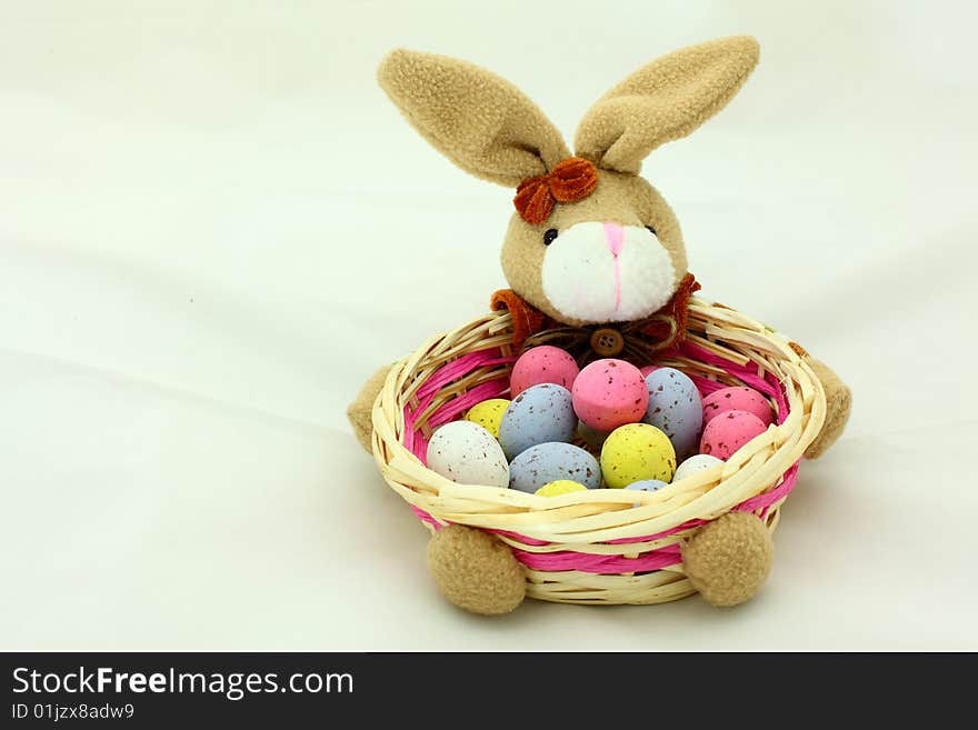 Close-up of easter bunny basket with colorful eggs