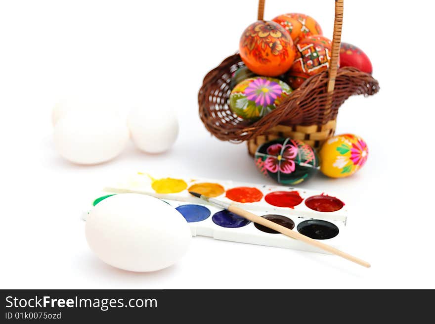 Painted and unpainted easter eggs, water-colour paints. Painted and unpainted easter eggs, water-colour paints