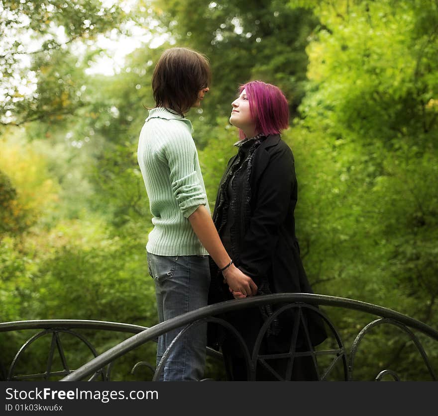 Attractive man and woman couple in love in the park. Attractive man and woman couple in love in the park