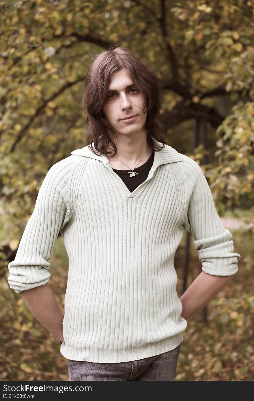 Handsome young man during his walk in a park