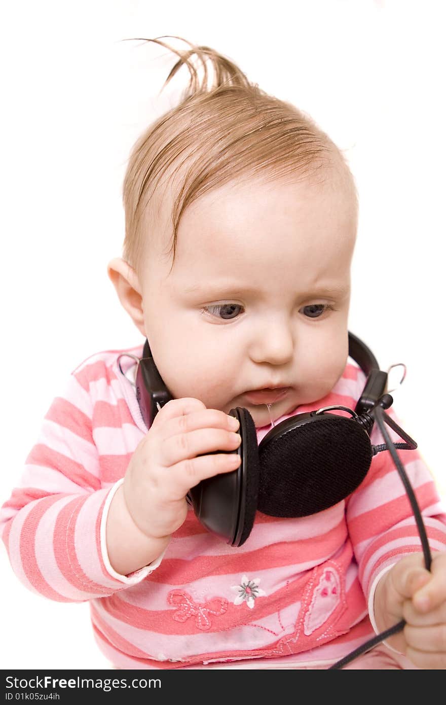 Baby with headphones on white