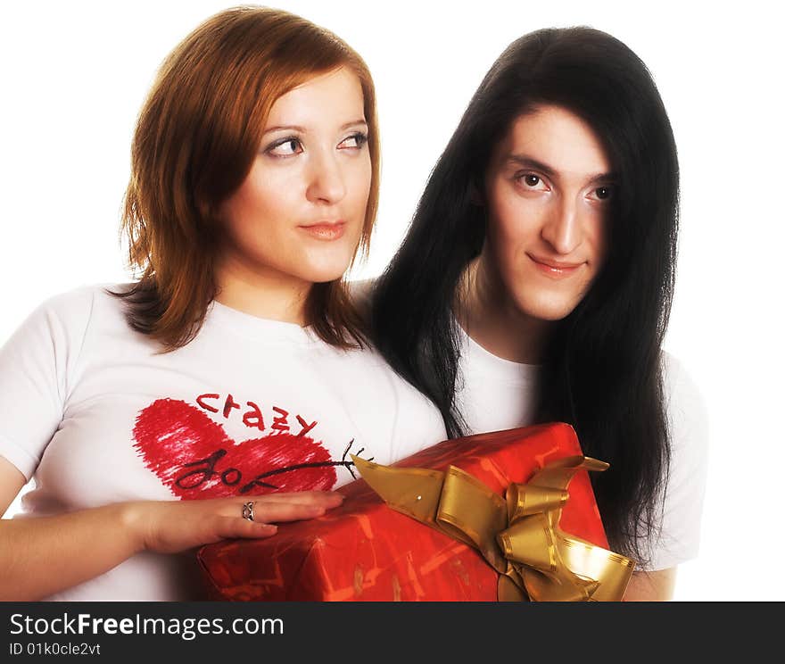 Young happy couple with big red present box.