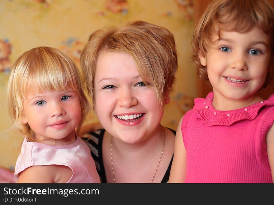 Smiling girl with two children