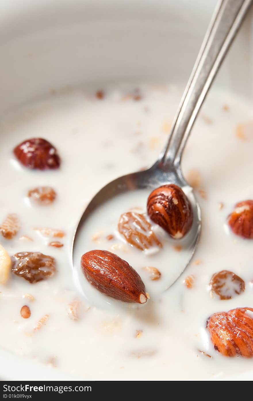 Breakfast cereal in a bowl with a spoon. Breakfast cereal in a bowl with a spoon