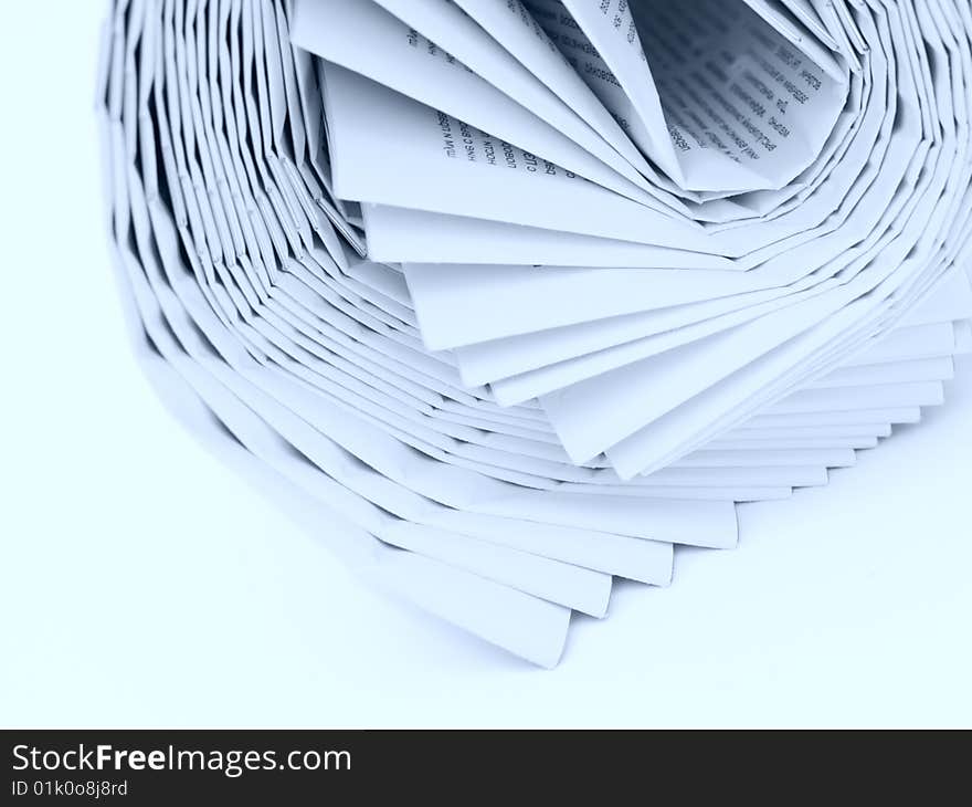 Roll of newspapers tinted blue isolated