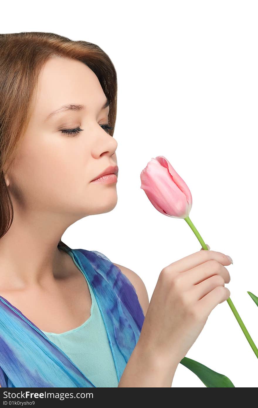 Girl  sniffing tulip over white