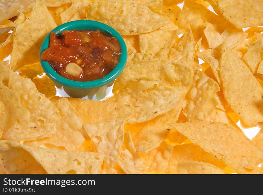 White flour tortilla chips with black bean and corn salsa. White flour tortilla chips with black bean and corn salsa