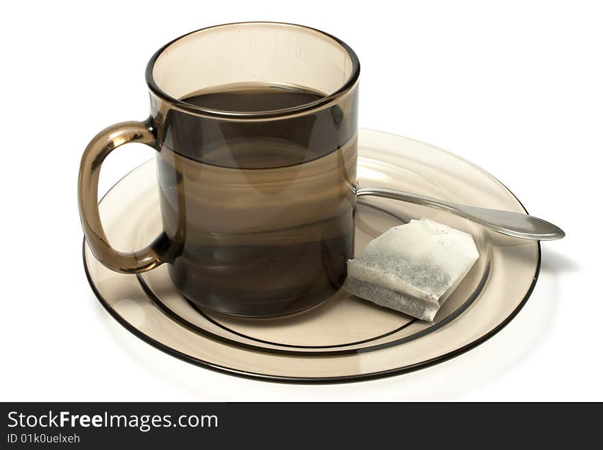 Tea cup and tea bag isolated on white