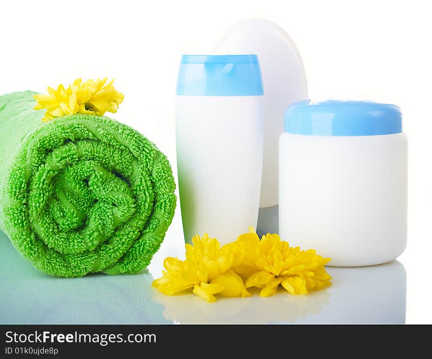 Composition from jars of perfumery and towels.