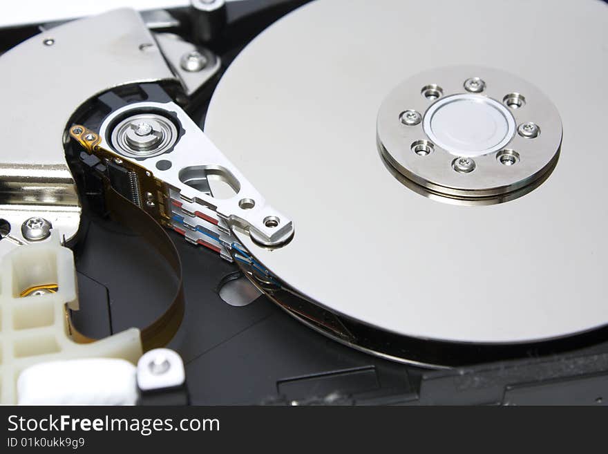 Closeup of the platters and read/write head of a computer hard drive. Closeup of the platters and read/write head of a computer hard drive