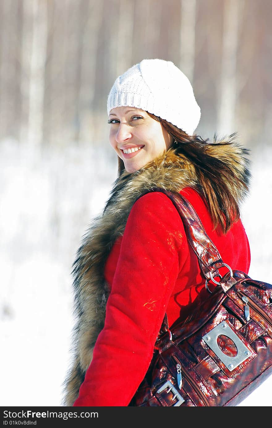 A portrait of young pretty woman in winter outwear. A portrait of young pretty woman in winter outwear