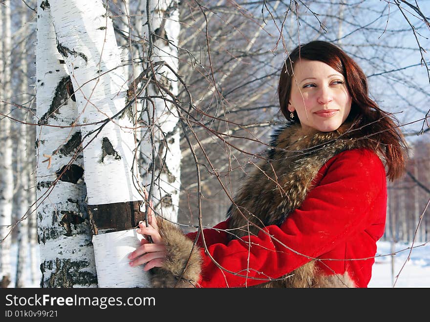 A portrait of young pretty woman in winter outwear. A portrait of young pretty woman in winter outwear