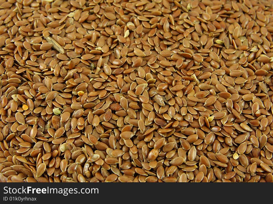 Brown linseed background, texture closeup