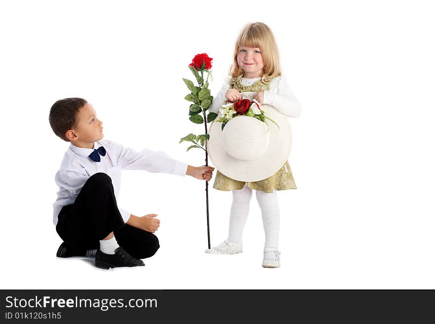 Little boy with rose and girl