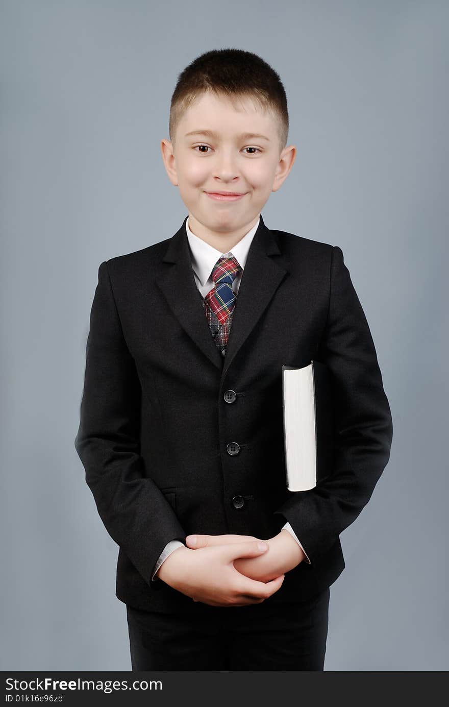 Smiling boy with black book. Smiling boy with black book