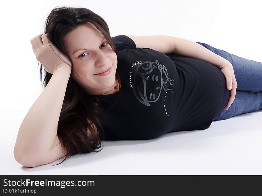 Pregnant woman smiling and lie on white background