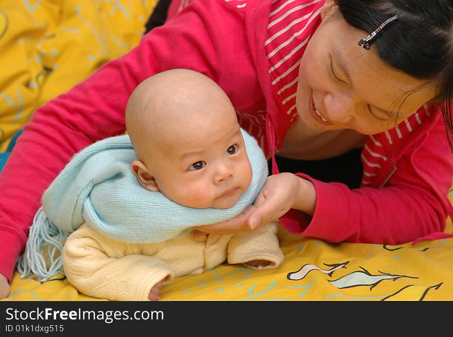 It is a cute chinese baby and his mother. he is 3 months. It is a cute chinese baby and his mother. he is 3 months.