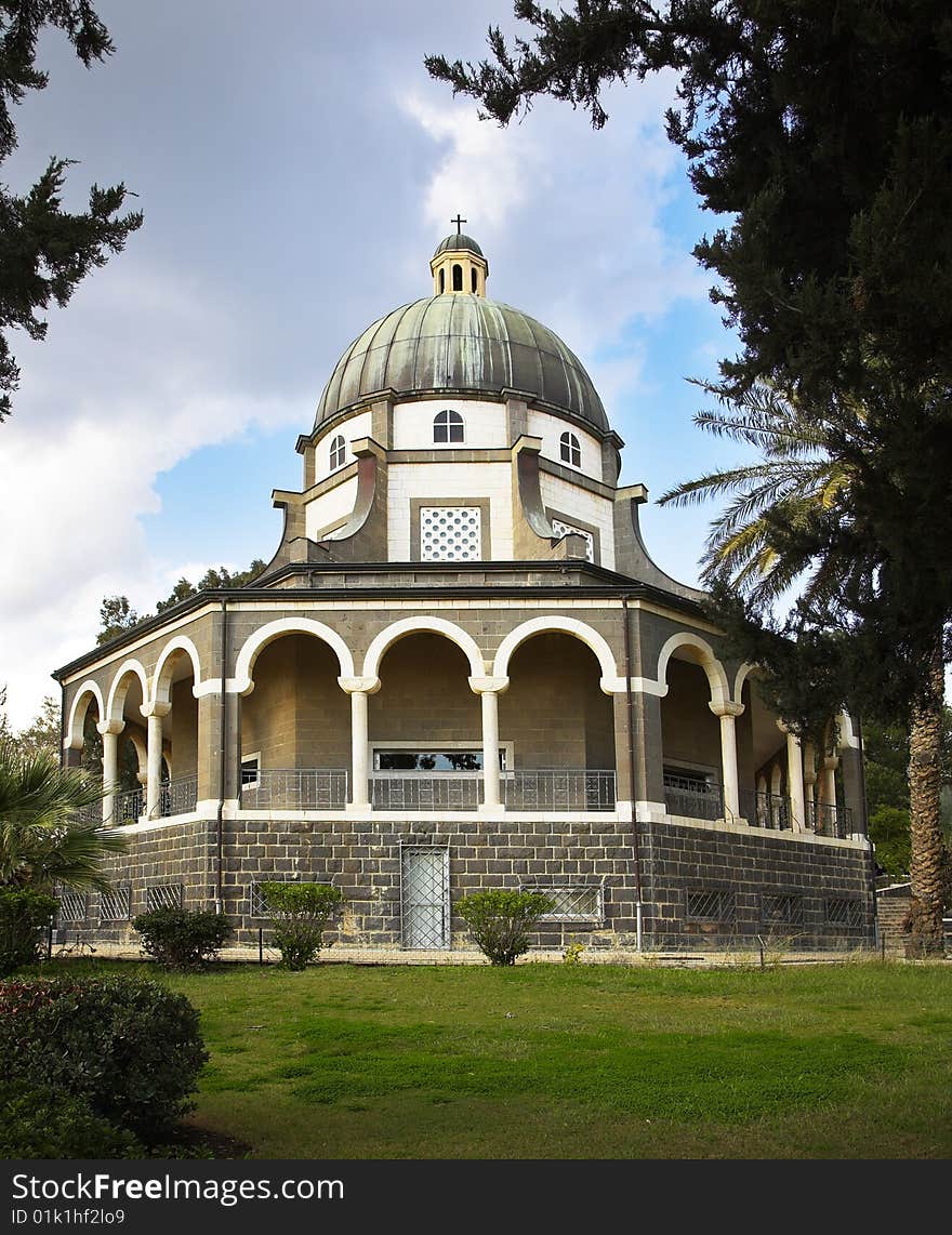 Showy church with a colonnade in monastic to a garden