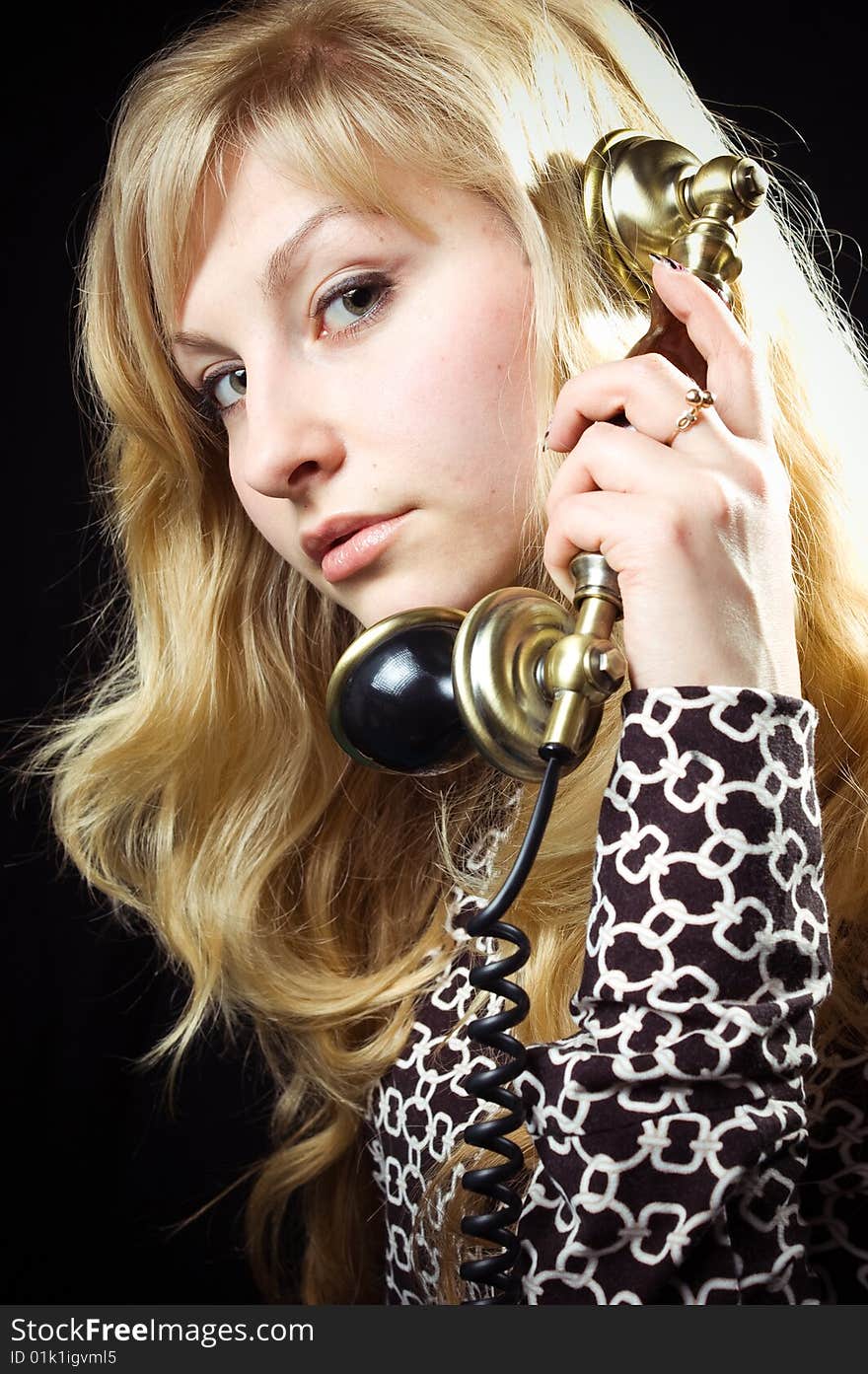 Beautiful caucasian woman talking on retro phone. Beautiful caucasian woman talking on retro phone.