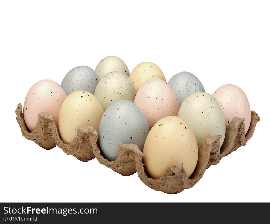 Pastel eggs in carton