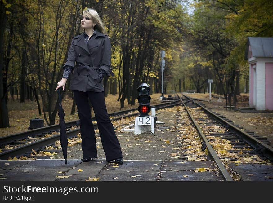 Beautiful woman with blonde long hair at autumn park. Beautiful woman with blonde long hair at autumn park.