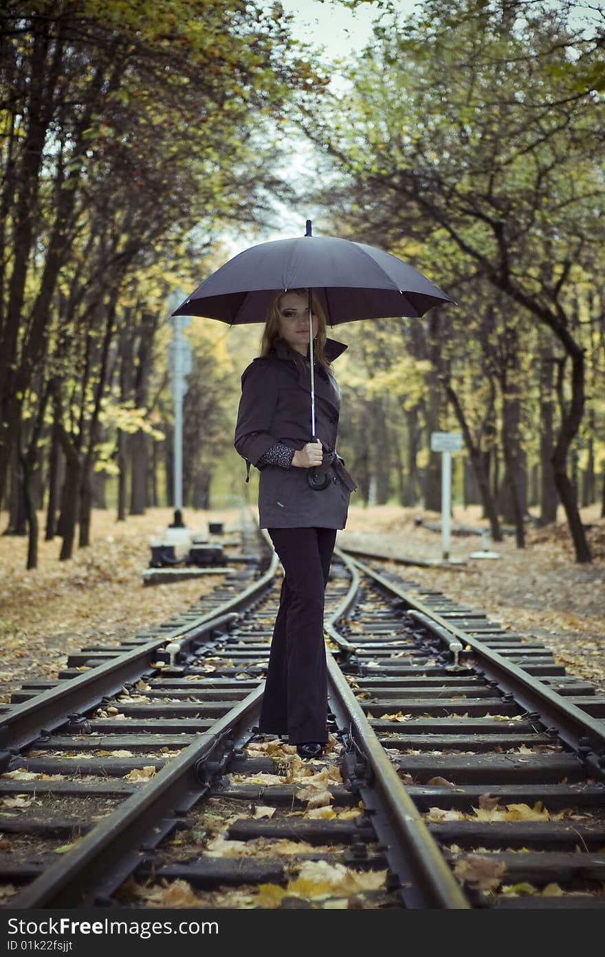 Beautiful woman with blonde long hair at autumn park. Beautiful woman with blonde long hair at autumn park.