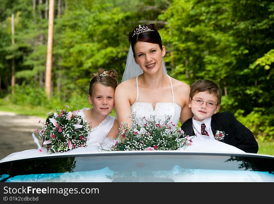 White Bride at her wedding posing with veil