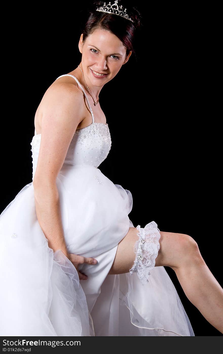 White Bride at her wedding posing with veil