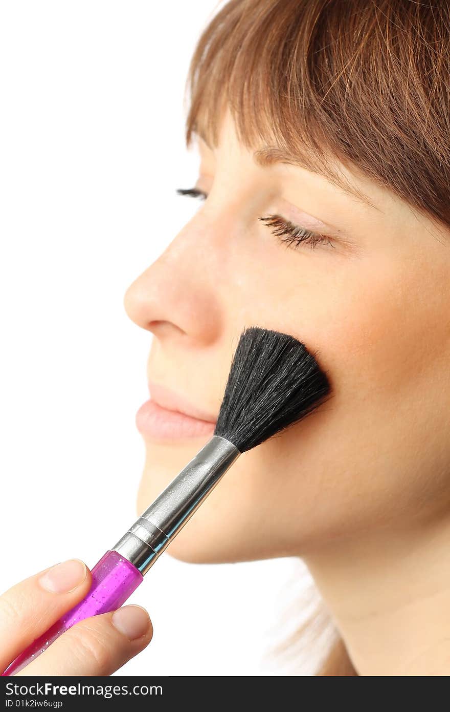 Young woman with make-up brush