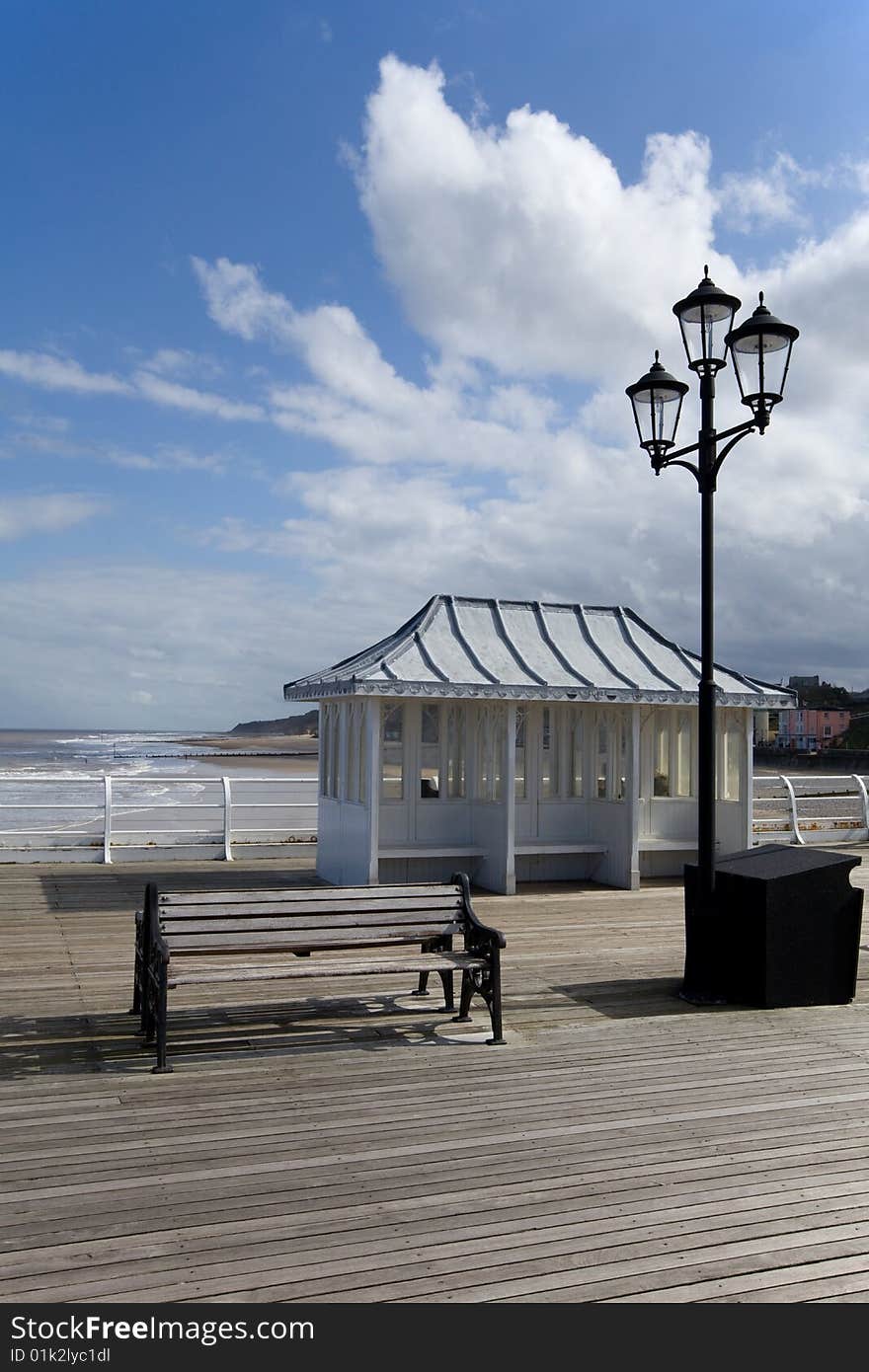 Traditional seating on a beautiful spring day along the seaside pier. Traditional seating on a beautiful spring day along the seaside pier