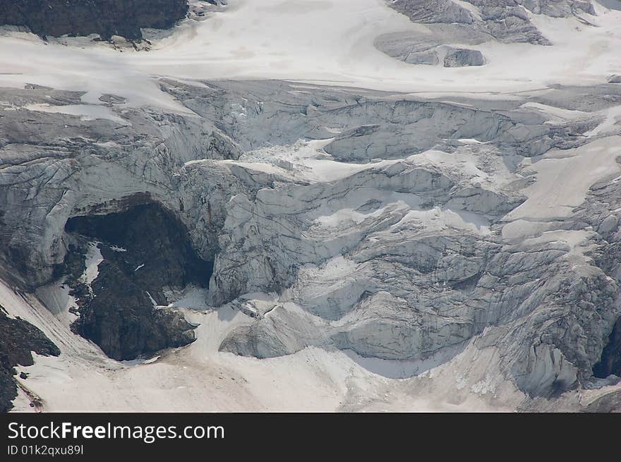 High mountain and glacier with cracks. High mountain and glacier with cracks