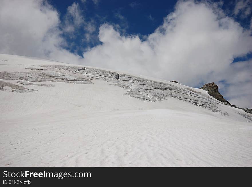 High mountain and glacier with cracks. High mountain and glacier with cracks