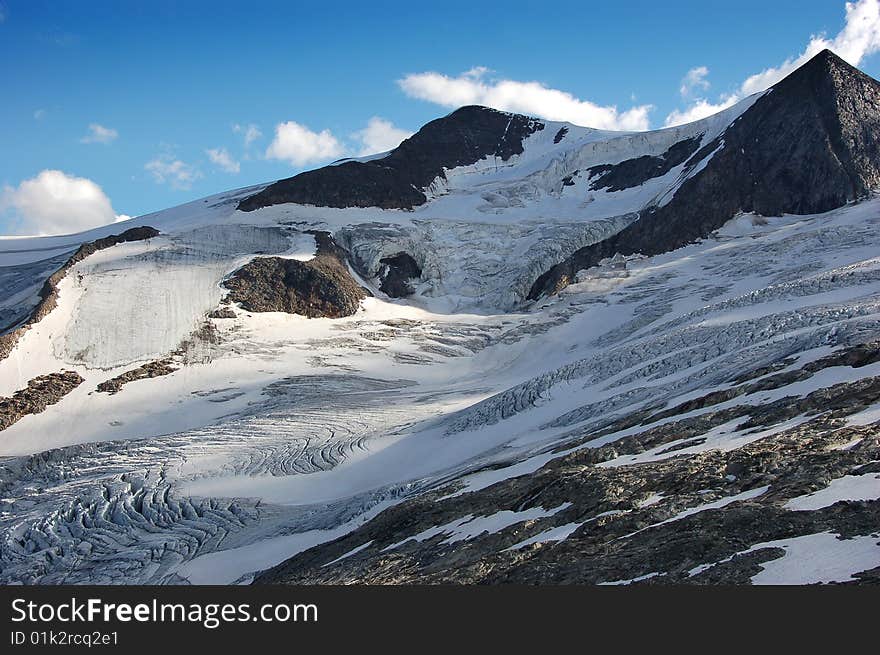 High mountain and glacier with cracks. High mountain and glacier with cracks